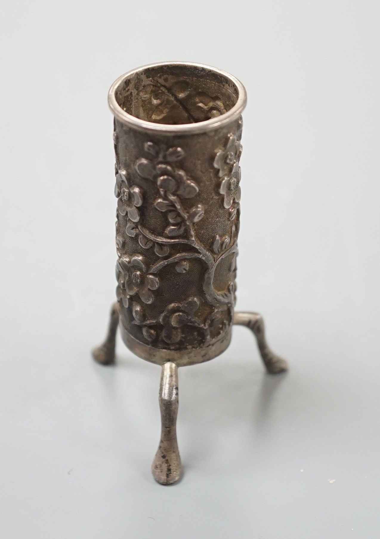 A Chinese silver sleeve vase, by Wang Hing, 7 cms high.